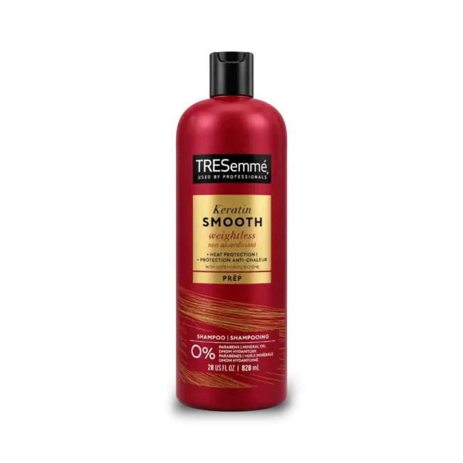 tresemme-keratin-smooth-weightless-shampoo A 28 ounce red bottle of TRESemme Keratin Smooth Weightless Shampoo showing the front label